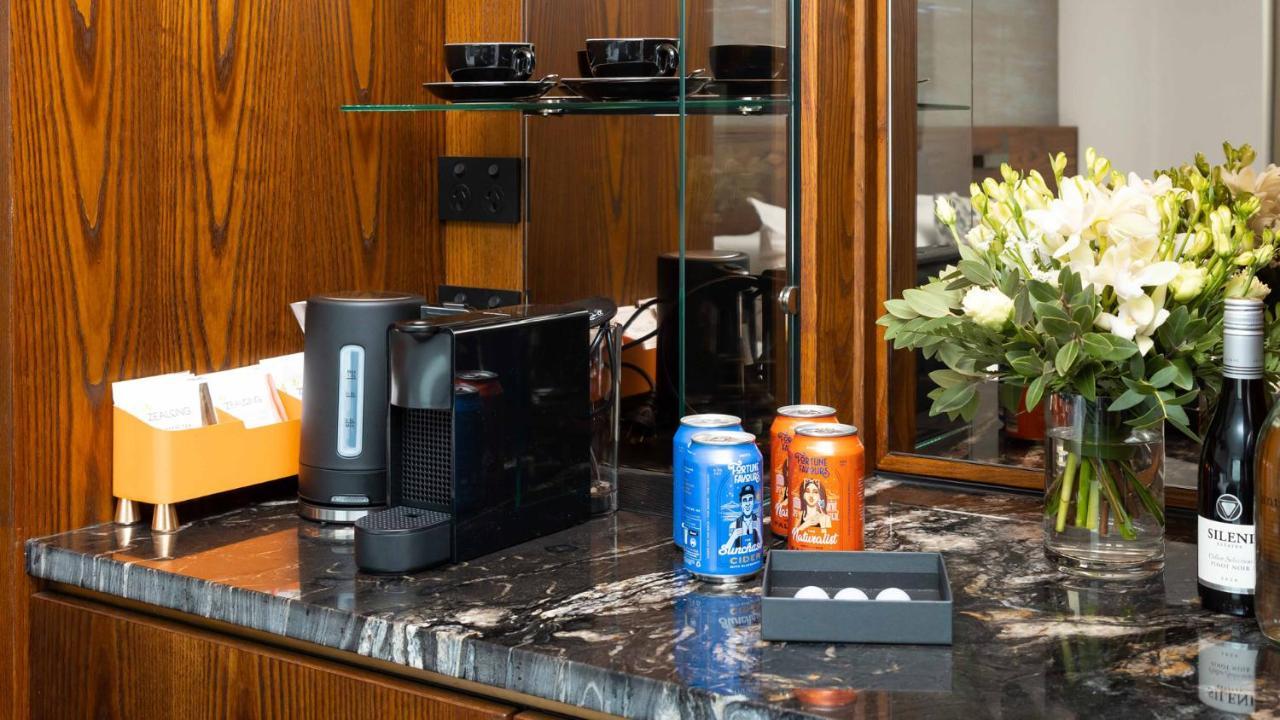 Horizon By Skycity Окленд Экстерьер фото A Nespresso coffee machine in a hotel room
